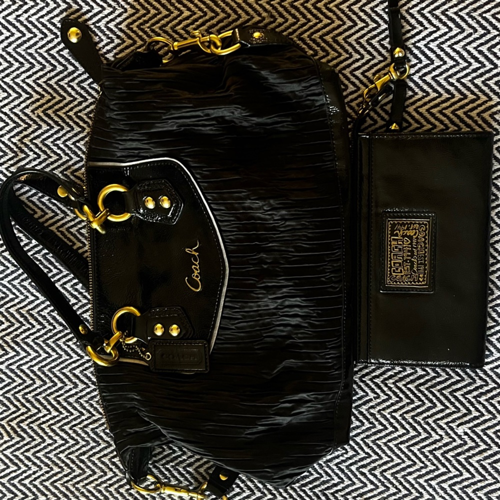 medium coach bag with its wallet.